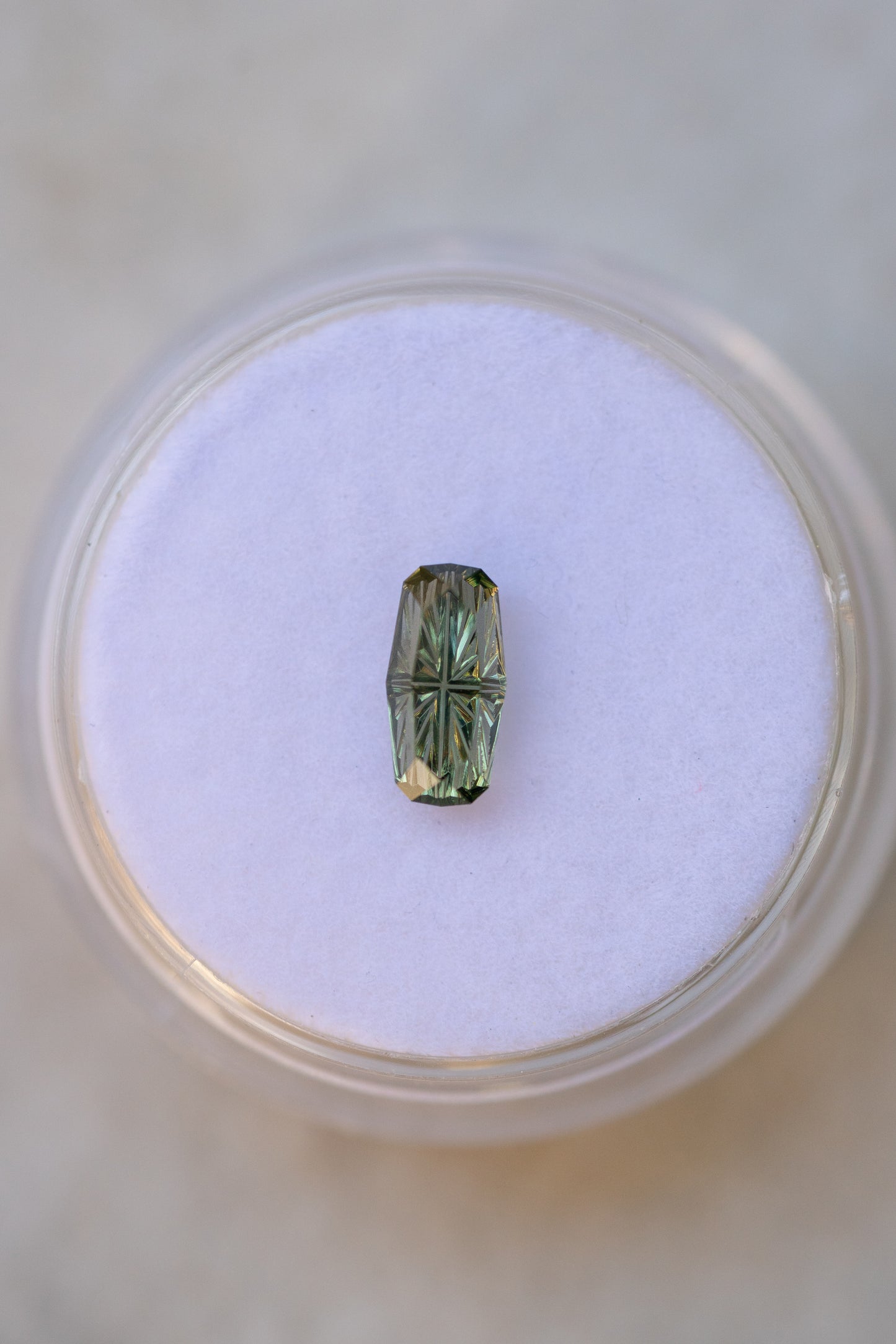 0.76 Carat Olive Green Fantasy Cut Cushion Montana Sapphire